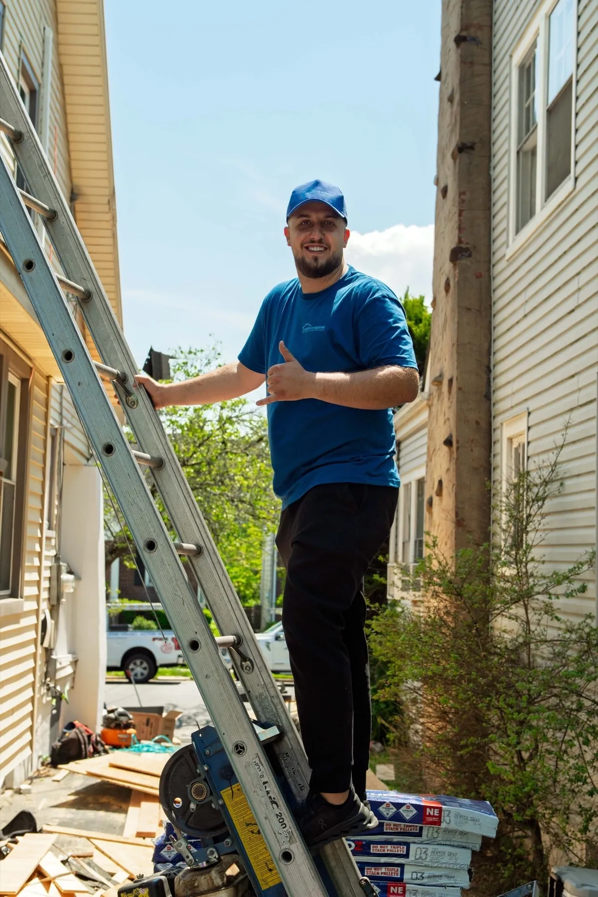 American Roofing crew member in uniform