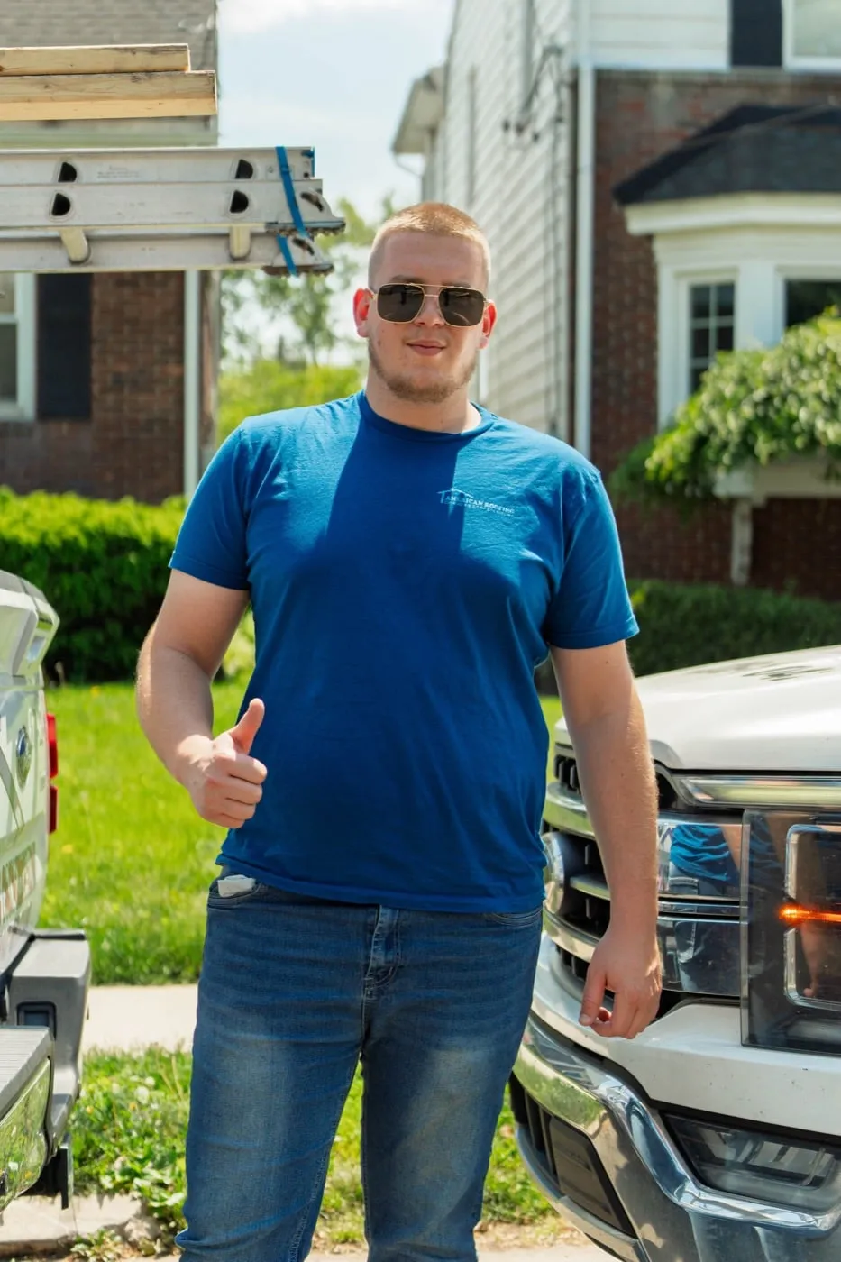 Local American Roofing crew member giving a thumbs up