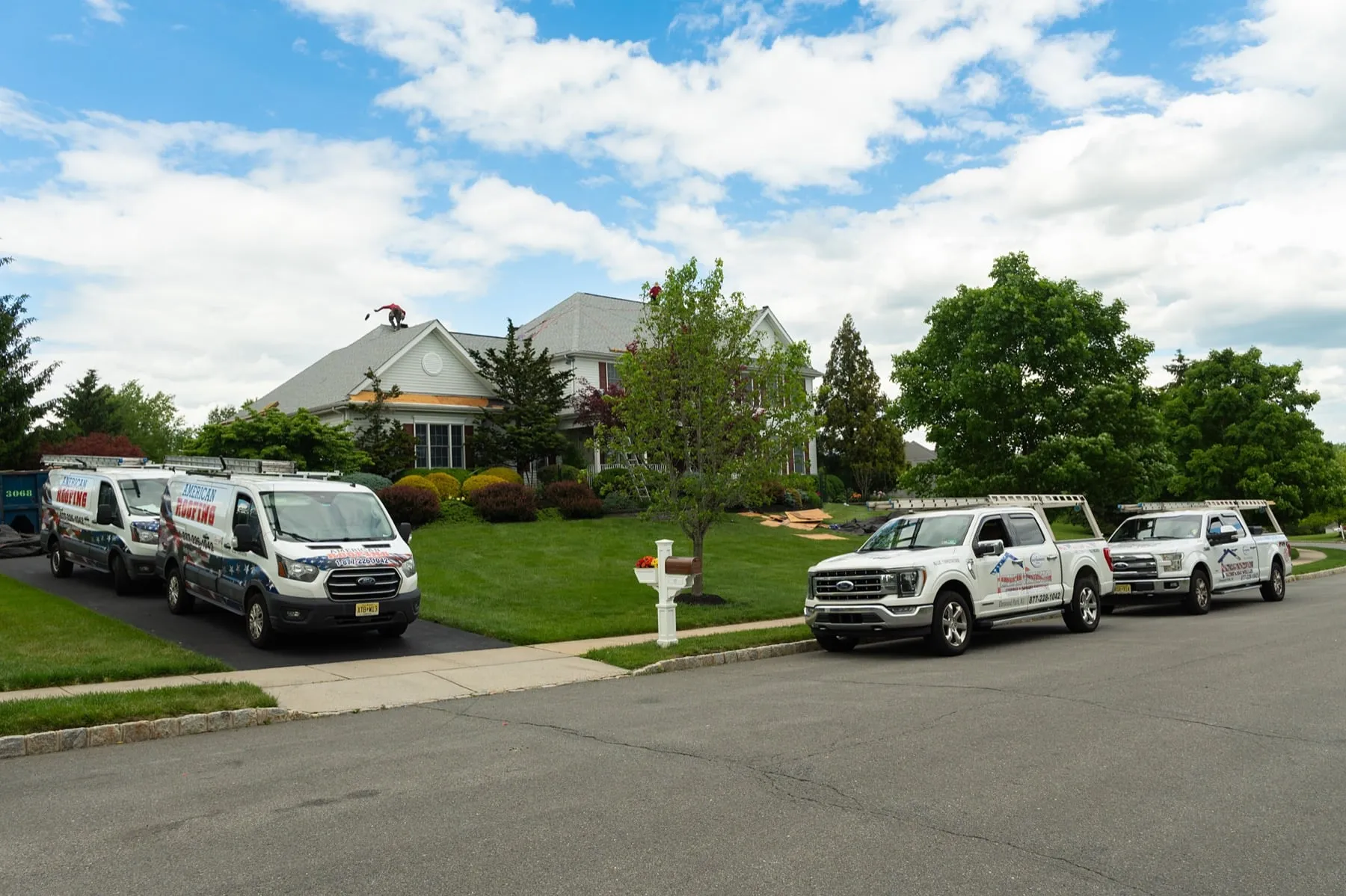 American Roofing fleet of vans and trucks