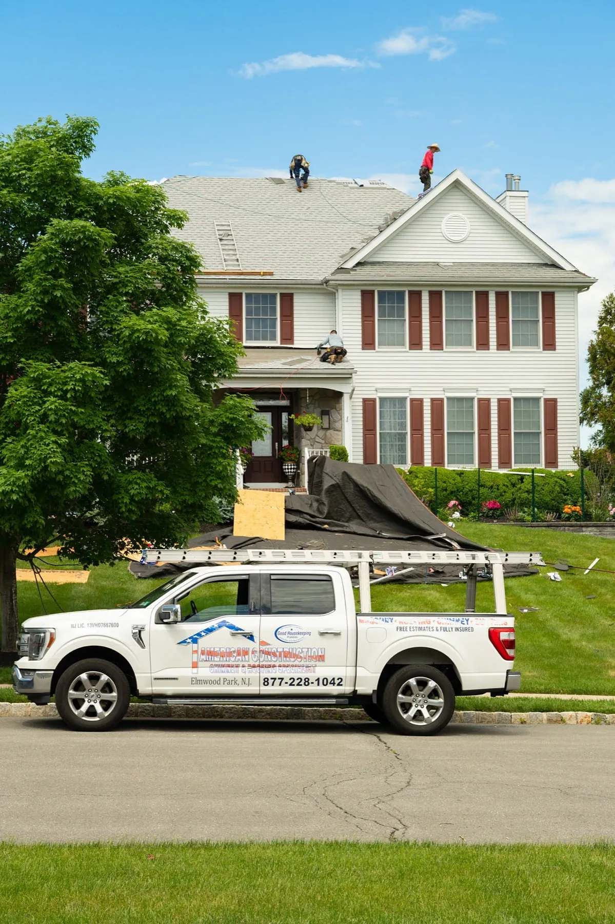 American Roofing truck at a job site