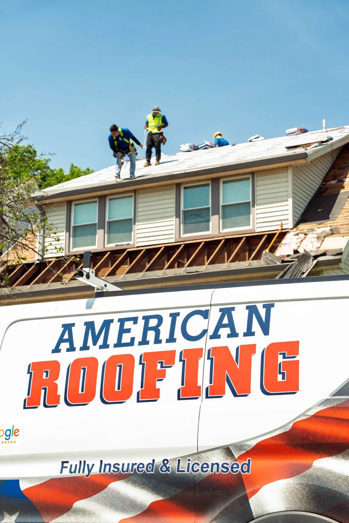American Roofing van parked at a home during a roof job